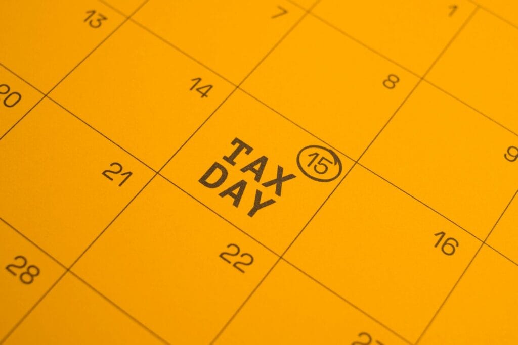 Calendar shows "tax day" circled on the 15th.